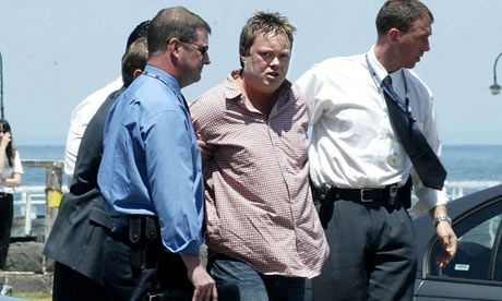 Carl Williams under arrest. later, in 2010 he was beaten to death in prison.