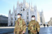 Italian Military officers wearing face masks outside Duomo cathedral, closed due to the coronavirus outbreak.