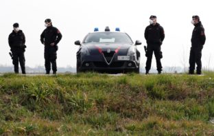 Drugs and Corona: How the Pandemic is Hurting Organized Crime Carabinieri officers wearing face masks on patrol.