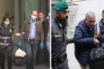 Angelo and Gaetano Fontana being escorted by police after their arrest during raids in Milan.