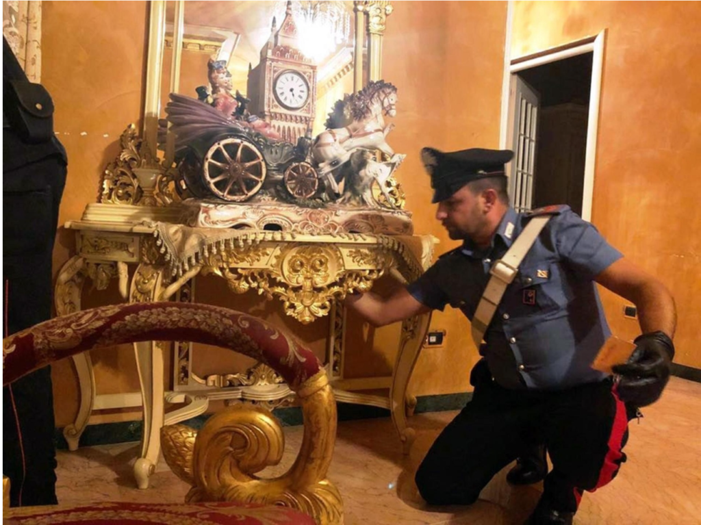 Italian Police search one of the houses seized from the Casamonica clan in an early morning raid.